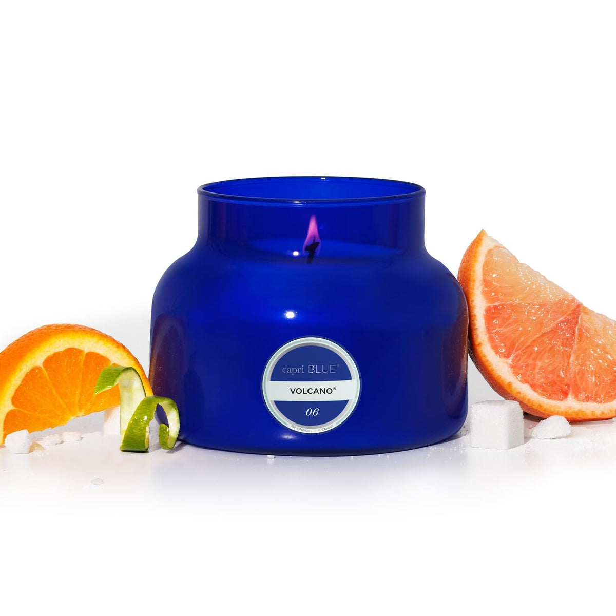 Capri Blue Volcano 19oz blue glass jar candle radiating tropical citrus fragrance