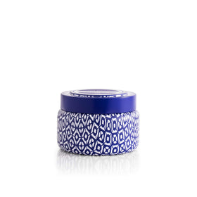 Capri Blue Volcano travel tin jar front view shows vibrant blue design and portable size.