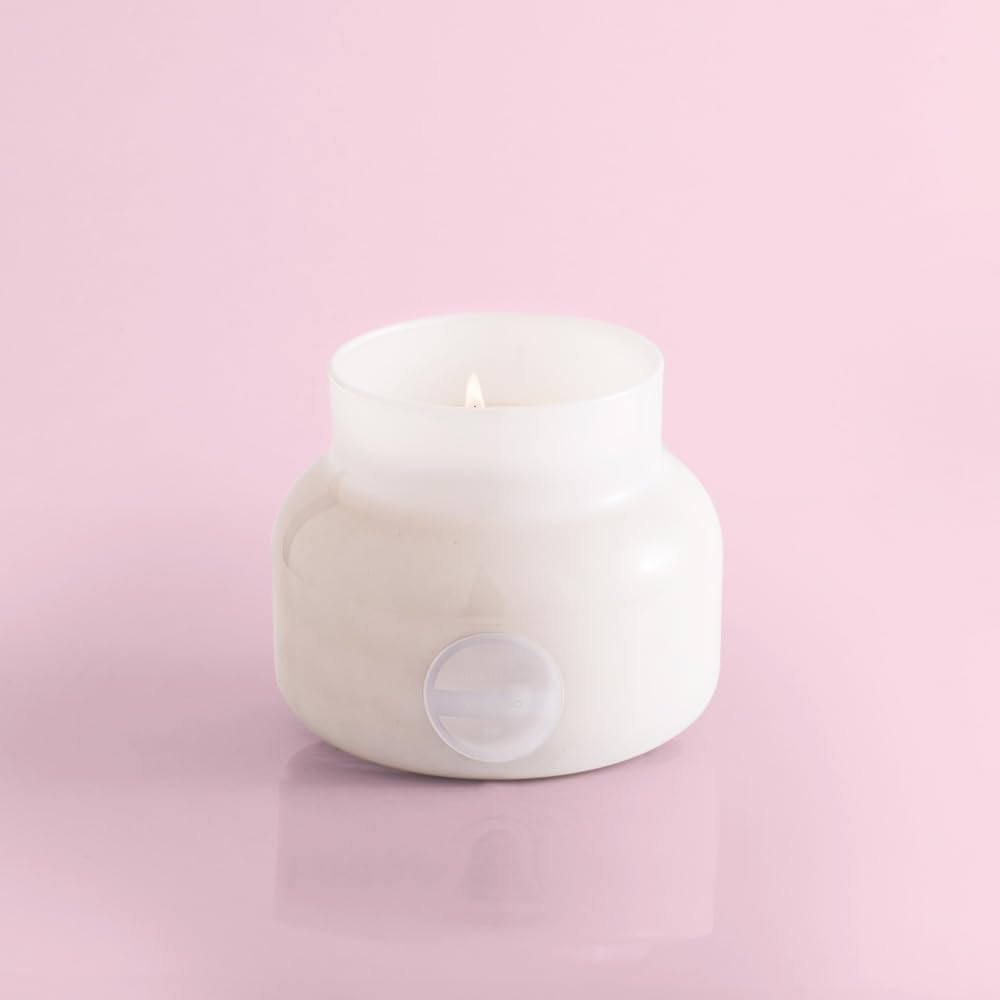 Capri Blue Volcano wick care for even burn and longevity.