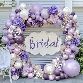 Captank purple curling ribbon completes the finish and ties the garland