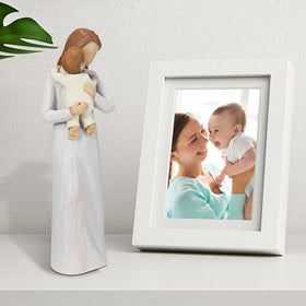 Carracci mother hug baby sculpture details warm, precious moments at home.