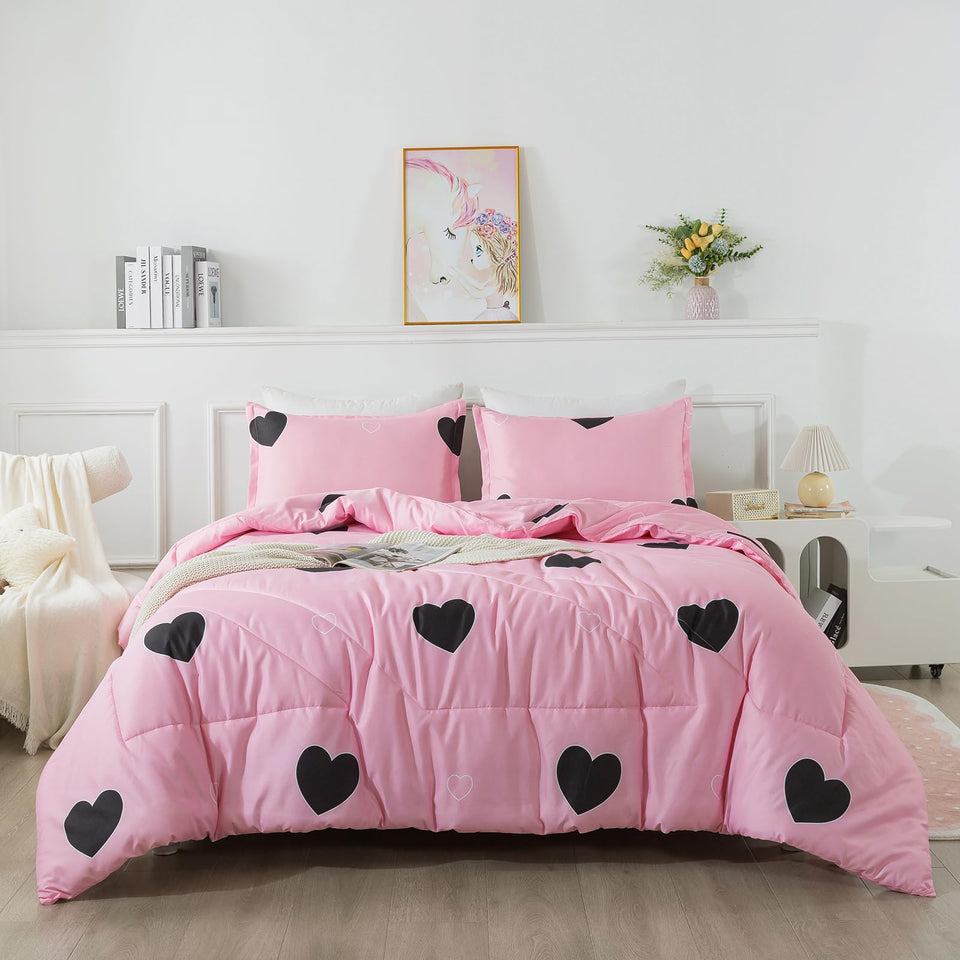 Caressma heart-print pink twin comforter on bed, stylish all-season warmth.