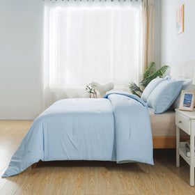 Caressma twin pillowcase completes the solid blue comforter set.