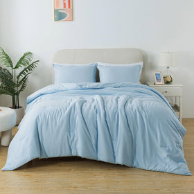 Caressma light blue twin comforter adds boho style and cozy comfort.