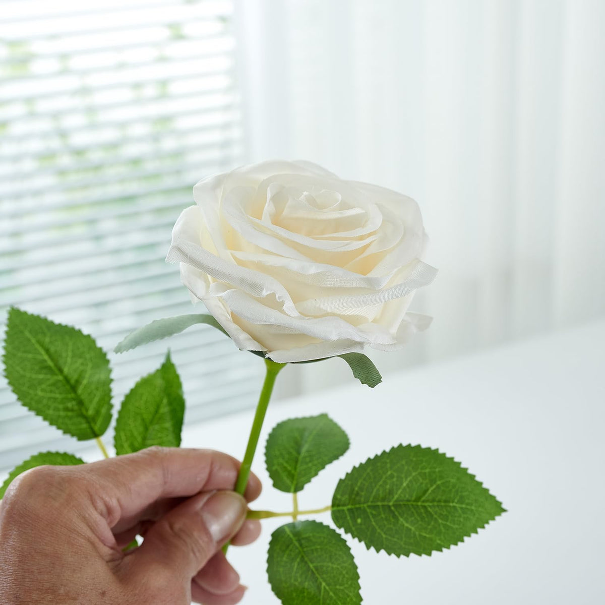 Close-up of Carlita's Blooms silk rose stems for easy arrangement