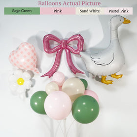 Carnira goose foil balloons add whimsical character to the arch setup.