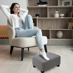 CAROLMADE compact footstool beside sofa for versatile use