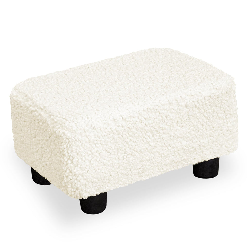 CAROLMADE foot stool with sherpa cover offers plush foot comfort.