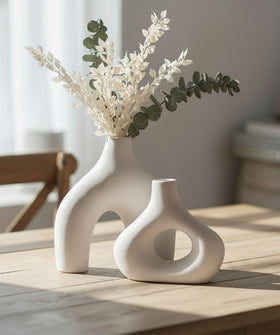 Carrot's Den donut vase hollow ring in white highlights minimalist decor and versatile placement.
