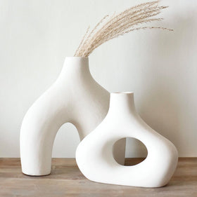 Carrot's Den donut vase pair complements weddings and living spaces with understated elegance.