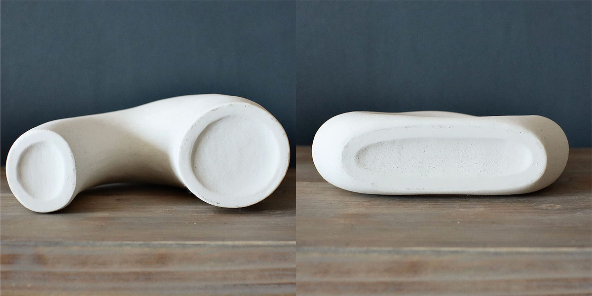 Carrot's Den donut vase white ceramic with hollow design suited for modern entryways.
