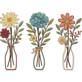 CarryWise 3-piece metal flower wall art in yellow and blue creates a bold focal point for living rooms.