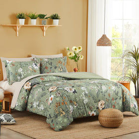 Close-up of green butterfly floral pattern on CasaAgusto bedding showing seersucker texture.