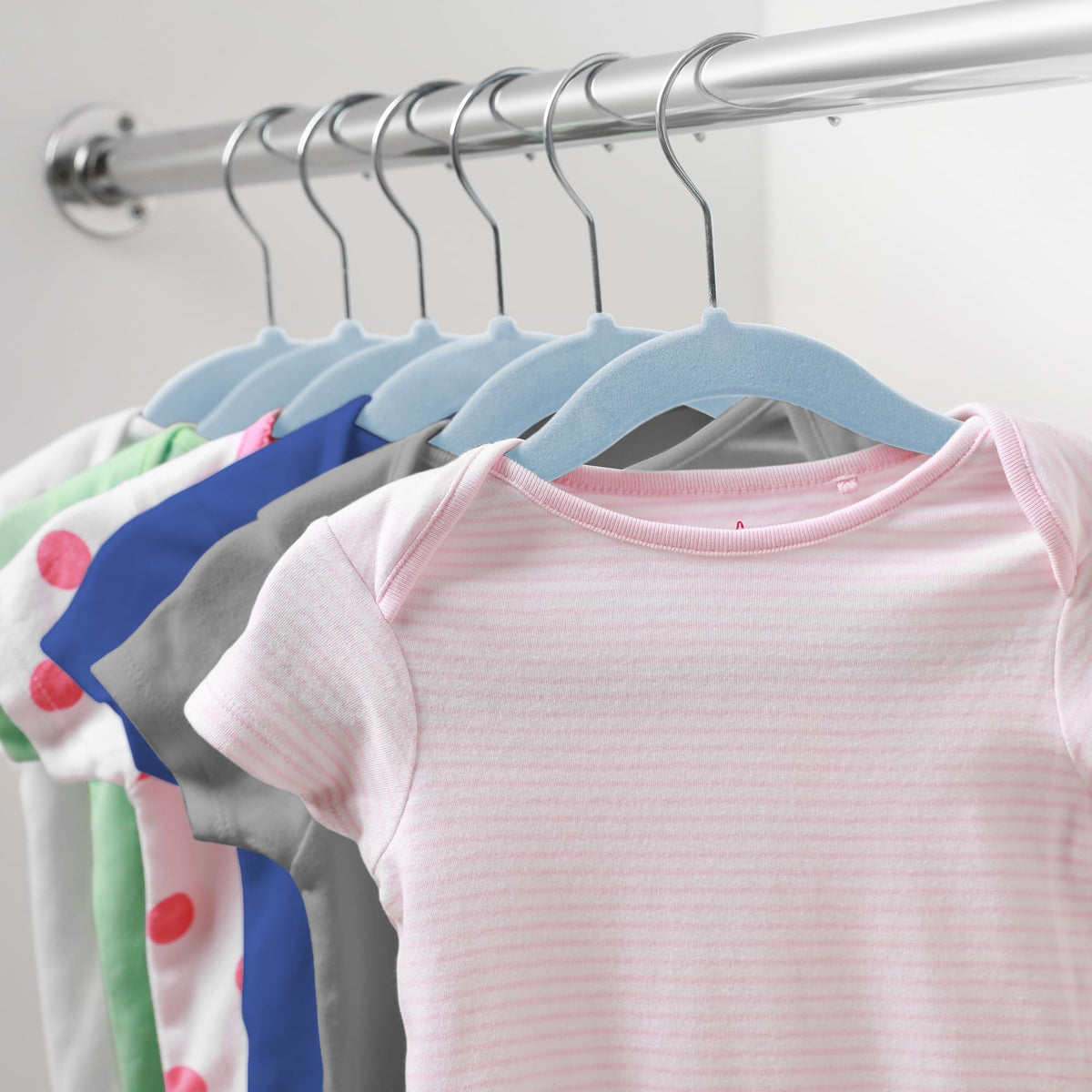 Slim profile optimizes closet space for nursery outfits.
