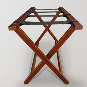 Casual Home luggage rack in a guest room scene ready for arrivals.