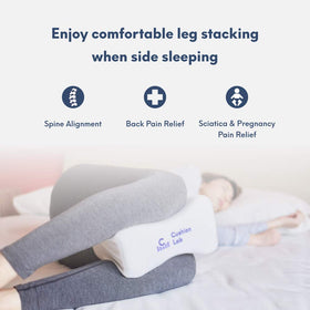 C CUSHION LAB knee pillow placed between legs promotes spine alignment and night relief.