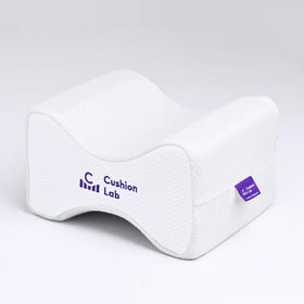 C CUSHION LAB knee pillow between thighs for side sleeping relief and proper alignment.