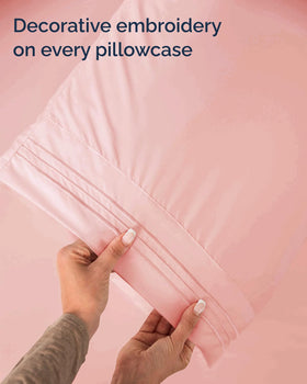 Baby pink CGK Unlimited bedding brightens the bedroom ambiance.