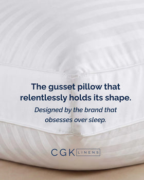 CGK Unlimited white pillows complement modern bedroom aesthetics.