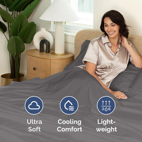 CGK Unlimited bed with duvet protected by elastic-free flat sheet.