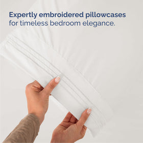 Bedroom setup featuring CGK Unlimited sheets on a deep mattress.