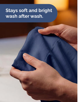 CGK Unlimited navy sheets shown on bed for a clean, inviting bedroom look