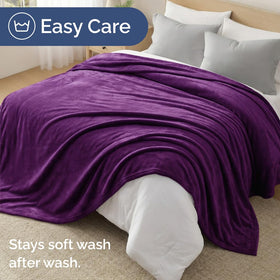 CGK Unlimited blanket on couch ideal for relaxed evenings and movie nights.