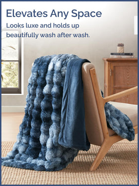CGK Unlimited blue throw draped on sofa adds a decorative cozy layer