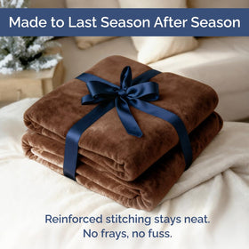 Brown CGK Unlimited cozy blanket styled in a bedroom setting