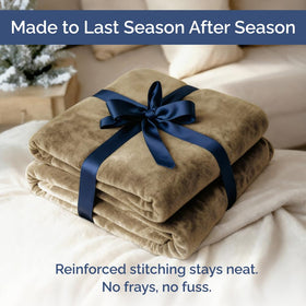 CGK Unlimited camel-colored microplush fleece blanket adds cozy ambience to any room
