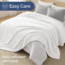 CGK Unlimited blanket folded for travel, showcasing compact portability.