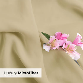 Cream CGK Unlimited king pillow cases in cozy bedroom.