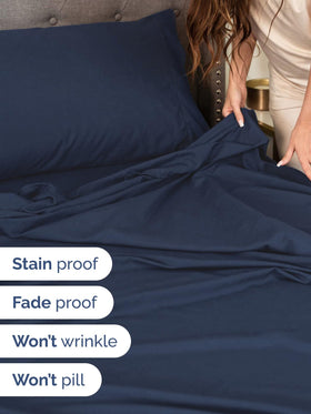 CGK Unlimited elastic-fit king sheets in navy for extra-deep mattresses.