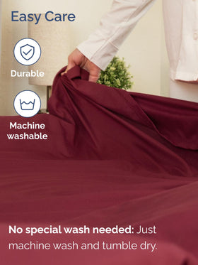CGK Unlimited bedding set displayed on a cozy burgundy bed setup