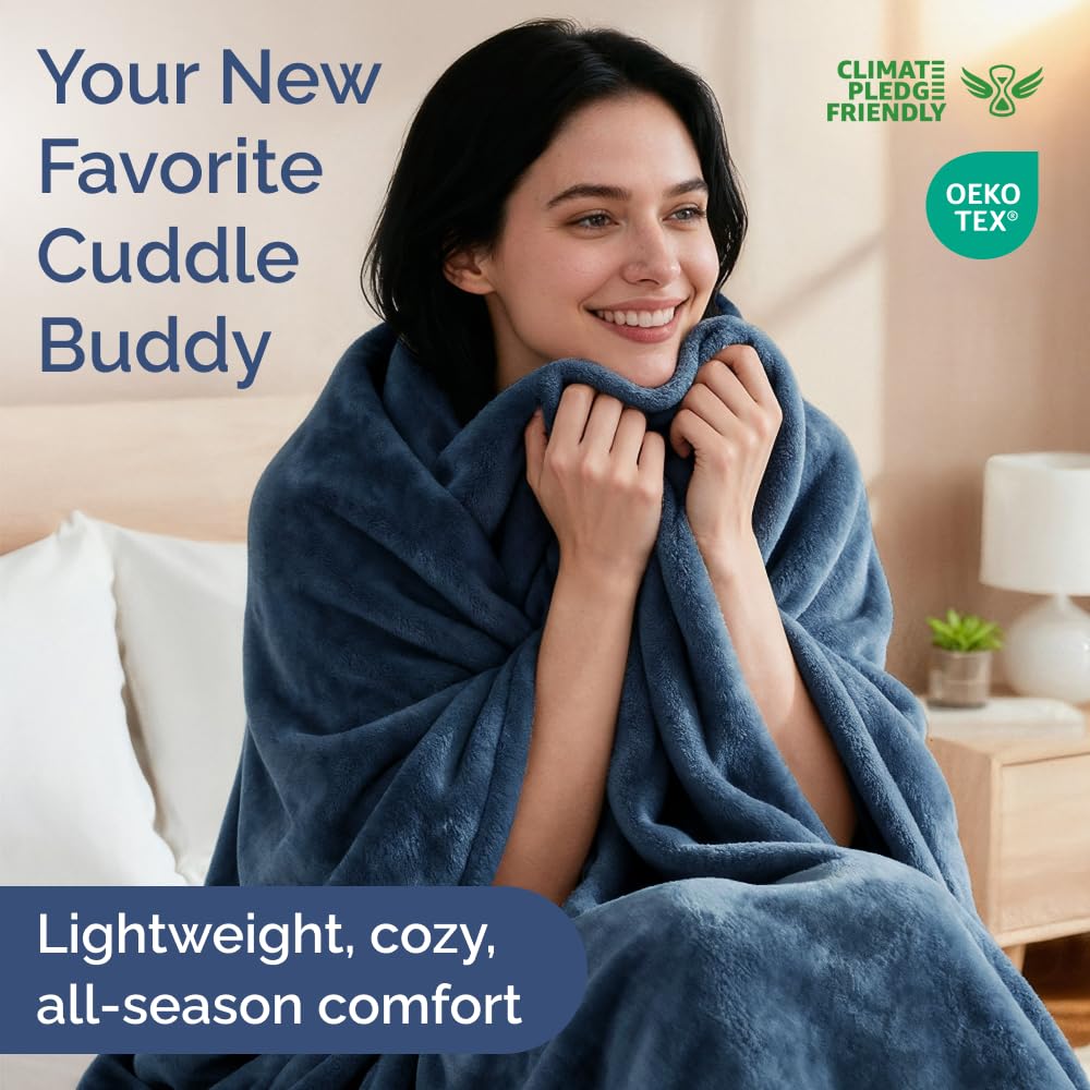 CGK Unlimited all-season queen blanket on a neatly made bed