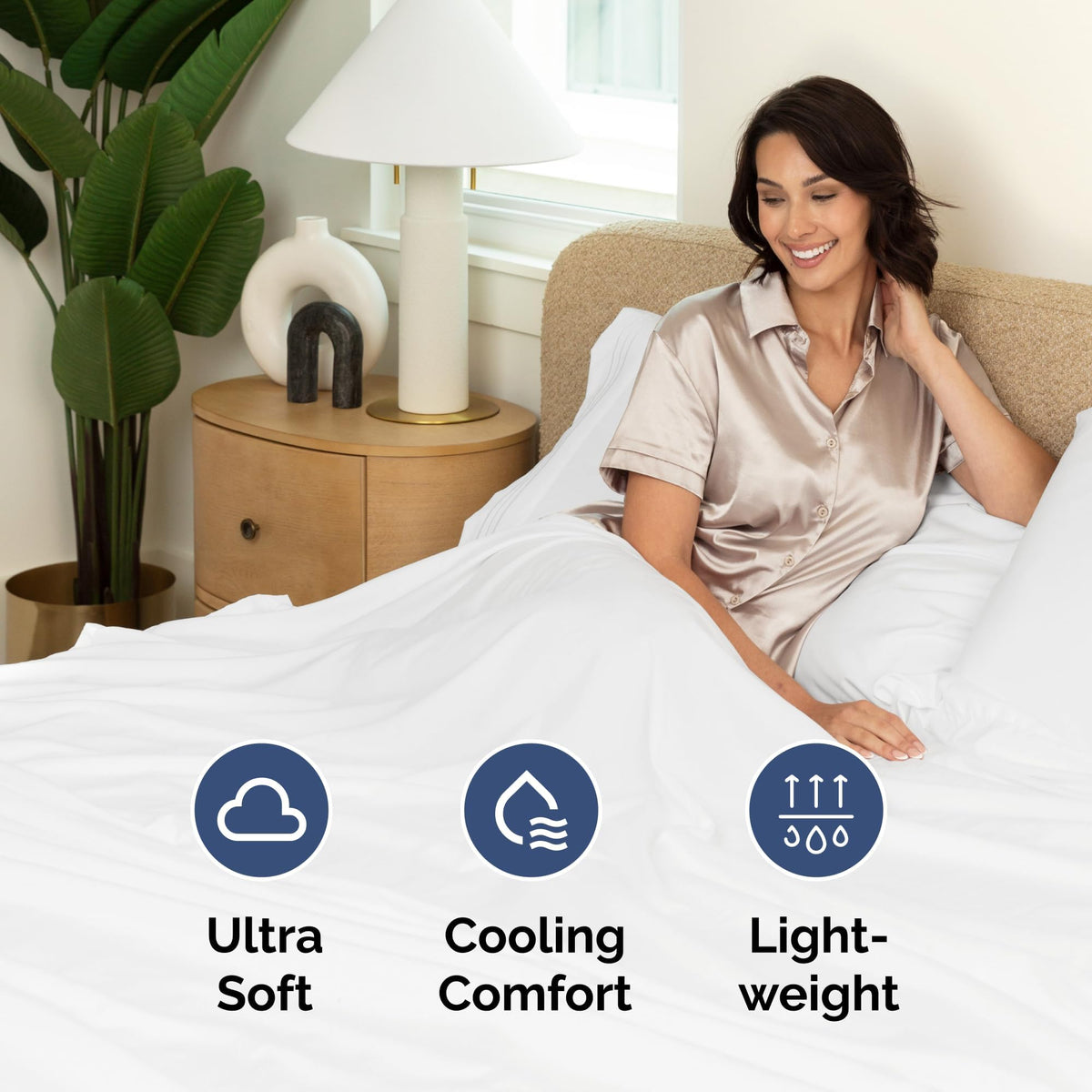 CGK Unlimited flat sheet draped over bed, top view in clean white.