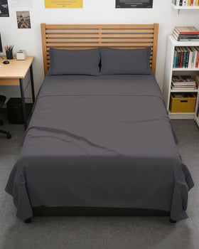 CGK Unlimited Full XL bed sheets flat lay reveal a sleek, modern dorm-ready aesthetic.