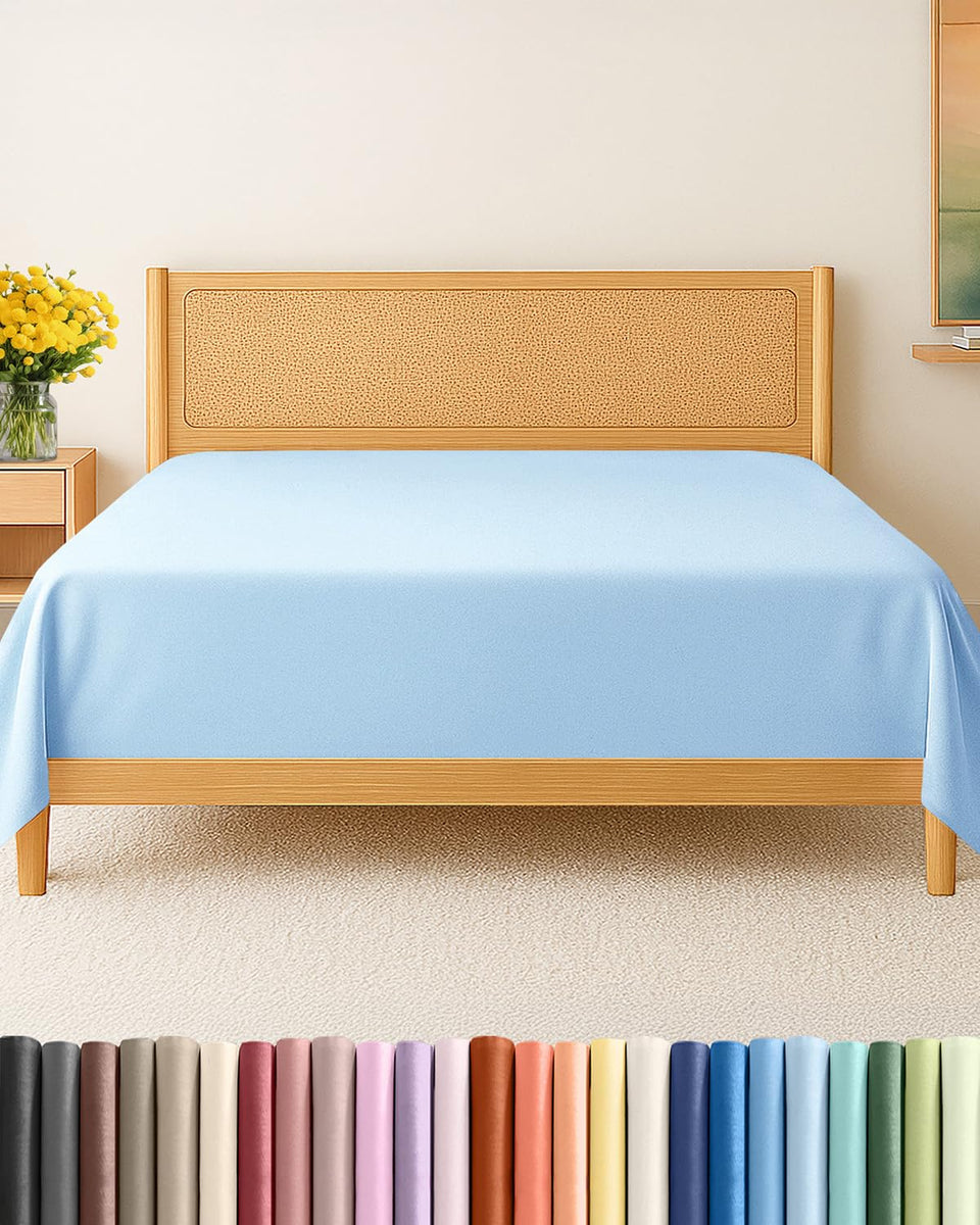 CGK Unlimited king-size flat sheet laid over bed for a tidy top layer