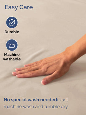 CGK Unlimited machine-washable wheat Cal King fitted sheet in laundry process