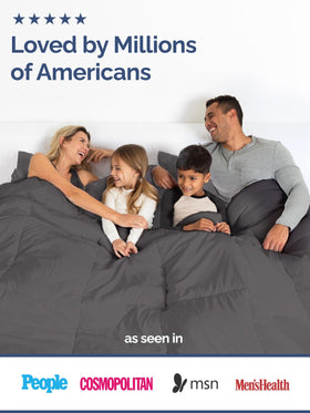 Modern CGK Unlimited bedding setup with dark gray comforter in a stylish room