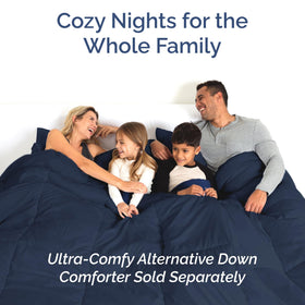 Bedroom setup shows navy CGK Unlimited sheet set for cozy sleep ambience.