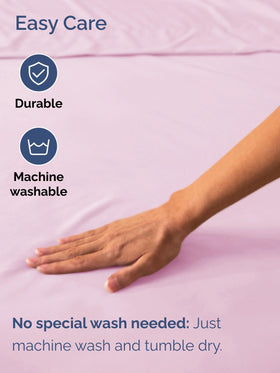Sheet hugging a mattress topper for a smooth, even surface.