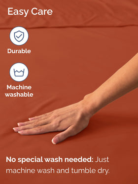 CGK Unlimited terracotta bedroom scene highlighting breathable soft king sheet