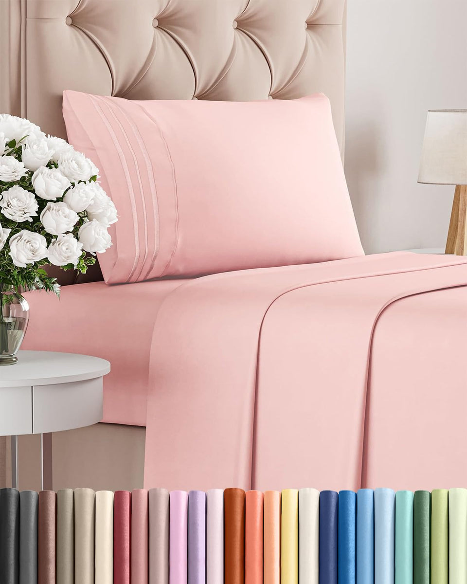 CGK Unlimited twin size 3-piece sheet set in baby pink on a tidy bed for luxurious comfort.