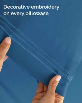 CGK Unlimited denim blue sheet set shows deep pockets keeping mattress secure