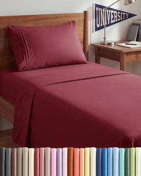CGK Unlimited Twin XL burgundy flat sheet close-up showing silky breathable fabric