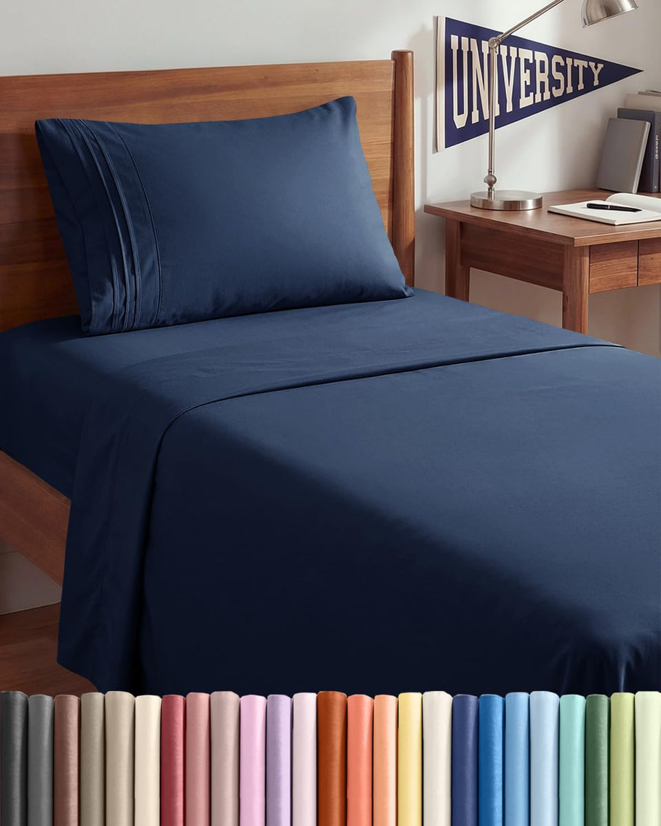 CGK Unlimited Twin XL sheet set in navy blue folded, easy storage.
