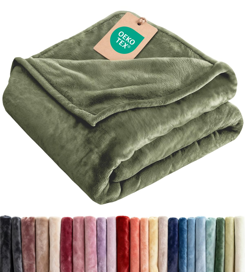 CGK Unlimited ultra-soft fleece blanket folded on a bed for cozy comfort.