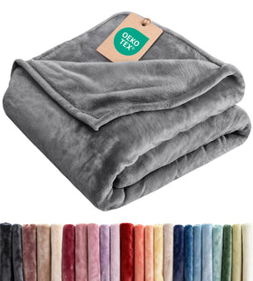 CGK Unlimited ultra-soft fleece blanket on a couch for cozy lounging.