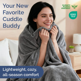 CGK Unlimited queen fleece blanket on bed, showcasing drape and warmth